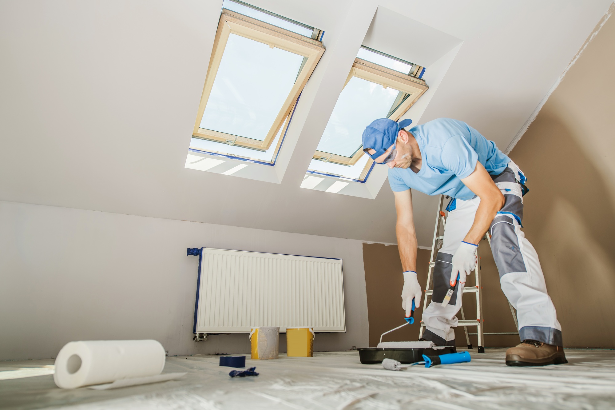 Caucasian Men Repainting His Apartment Walls